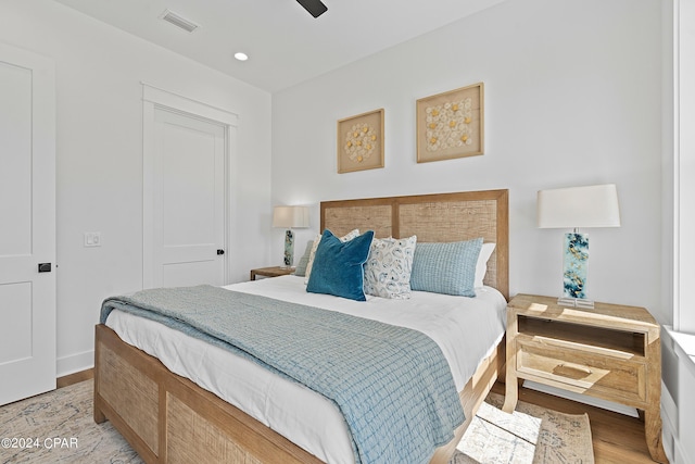 bedroom with ceiling fan, a closet, and light wood-type flooring