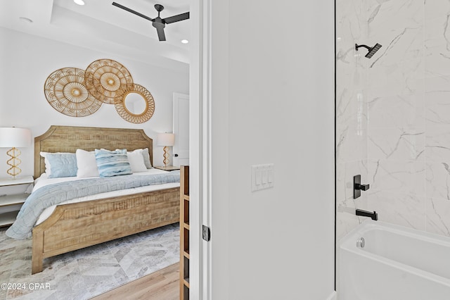 bedroom with wood-type flooring and ceiling fan