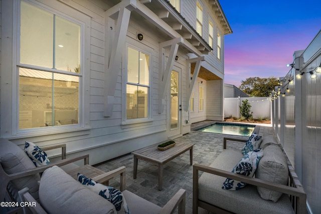 exterior space with an outdoor hangout area and a patio