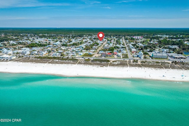 bird's eye view with a water view and a beach view