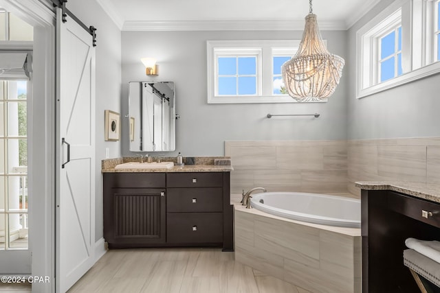 full bathroom with a garden tub, ornamental molding, vanity, and a chandelier