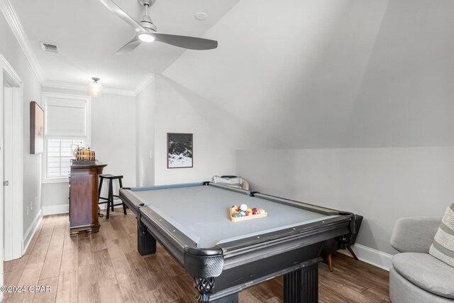 recreation room featuring baseboards, visible vents, wood finished floors, ceiling fan, and crown molding