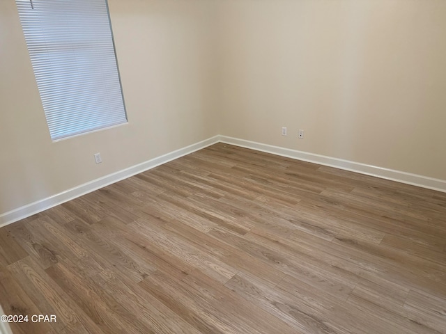 unfurnished room featuring light wood-type flooring