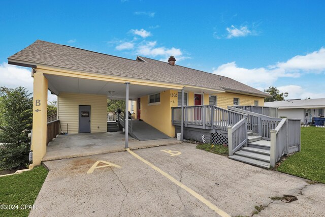 view of front of property with a carport