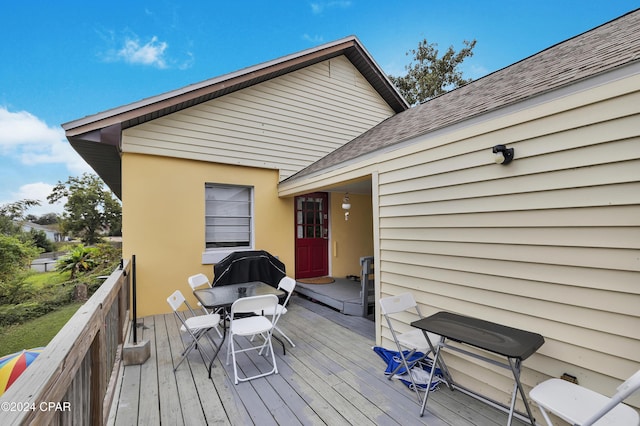 wooden deck featuring area for grilling