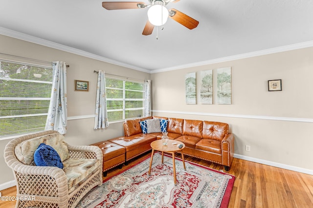 living room featuring crown molding, hardwood / wood-style flooring, and ceiling fan