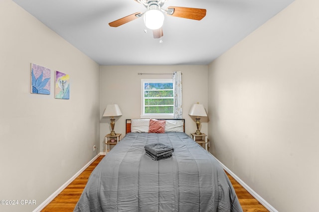 bedroom featuring wood-type flooring and ceiling fan