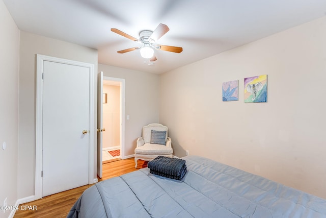 bedroom featuring light hardwood / wood-style flooring and ceiling fan