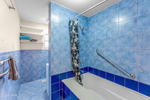 bathroom with tile walls and shower / tub combo