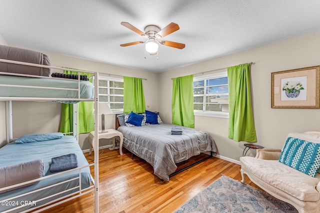 bedroom featuring ceiling fan and light hardwood / wood-style flooring