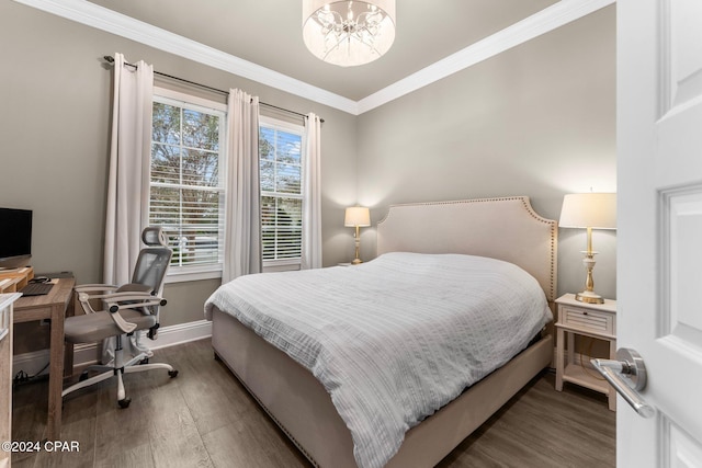 bedroom with a chandelier, crown molding, and dark wood-type flooring