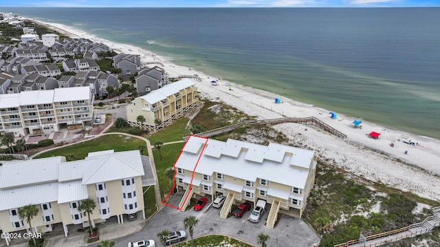 bird's eye view featuring a beach view and a water view