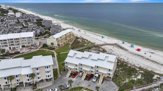 birds eye view of property with a view of the beach and a water view