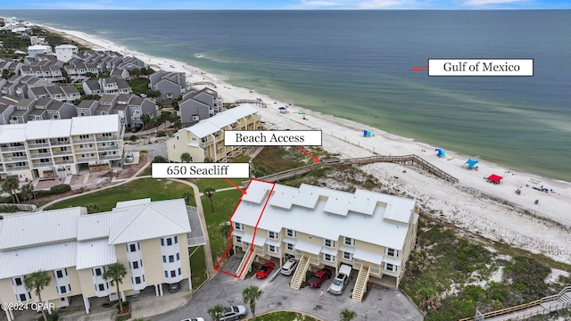 aerial view featuring a view of the beach and a water view