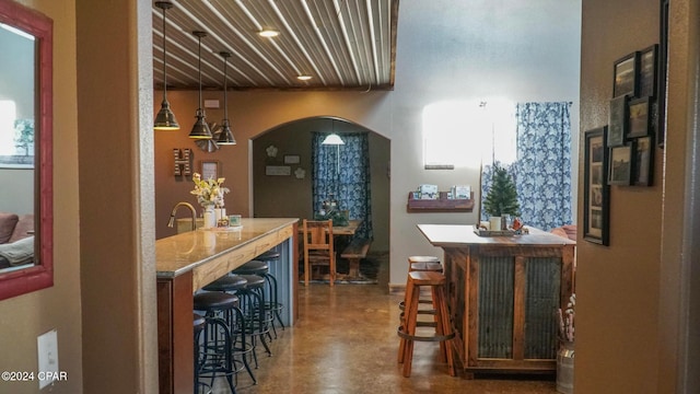 bar featuring decorative light fixtures