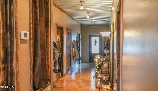 hallway with concrete flooring