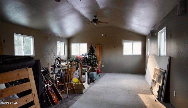 interior space with lofted ceiling and ceiling fan