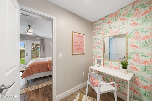 office area featuring visible vents, baseboards, french doors, dark wood-style floors, and wallpapered walls