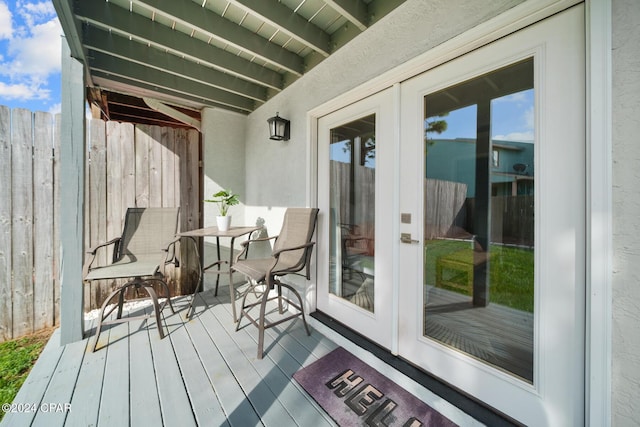 wooden terrace featuring french doors