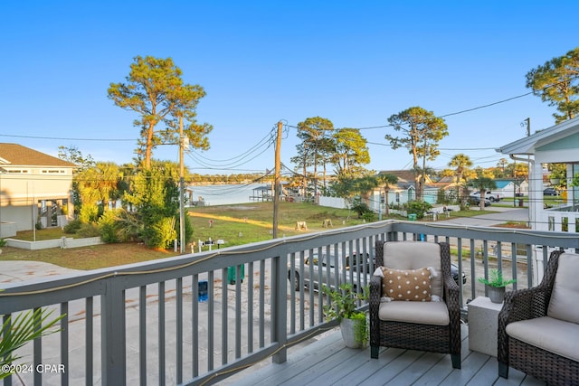 wooden terrace with a residential view