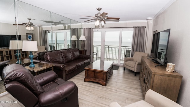 living room with ornamental molding and ceiling fan