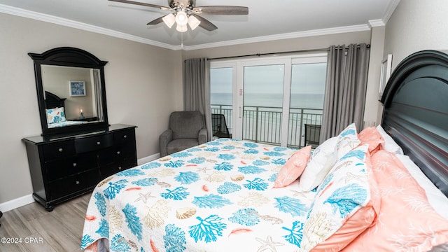 bedroom with access to exterior, ceiling fan, crown molding, a water view, and light hardwood / wood-style flooring