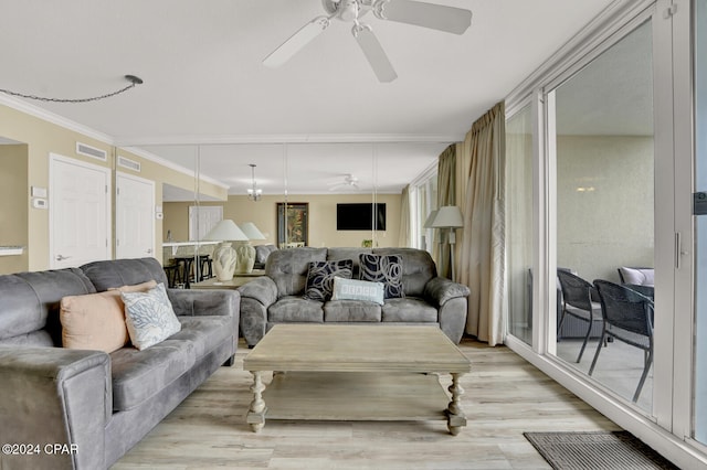 living room featuring ceiling fan, ornamental molding, and light hardwood / wood-style flooring