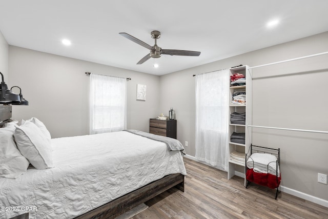 bedroom featuring wood-type flooring and ceiling fan