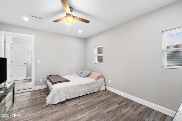 bedroom featuring dark wood-type flooring and ceiling fan