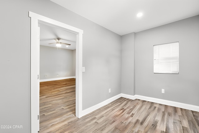 empty room featuring ceiling fan and light wood-type flooring