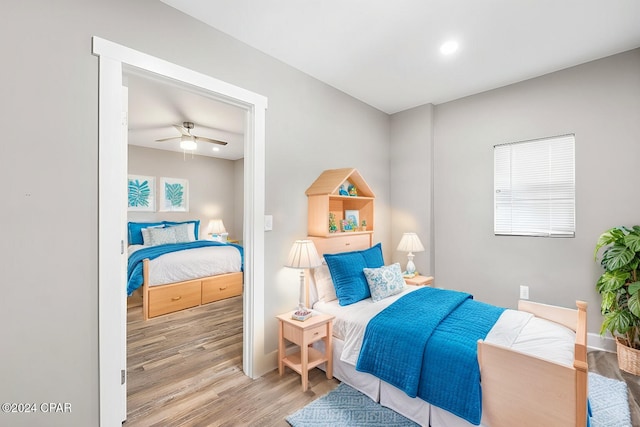 bedroom featuring light wood-type flooring and ceiling fan