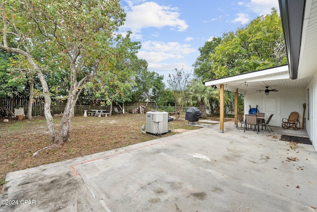 view of patio with a grill and ceiling fan