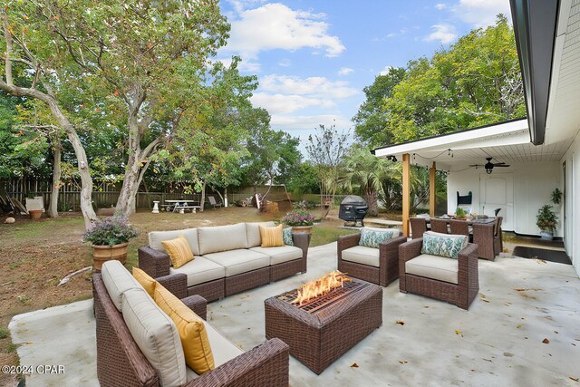 view of patio / terrace featuring ceiling fan, an outdoor hangout area, and grilling area