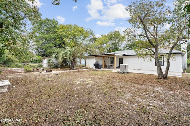 back of property featuring a patio and central AC unit