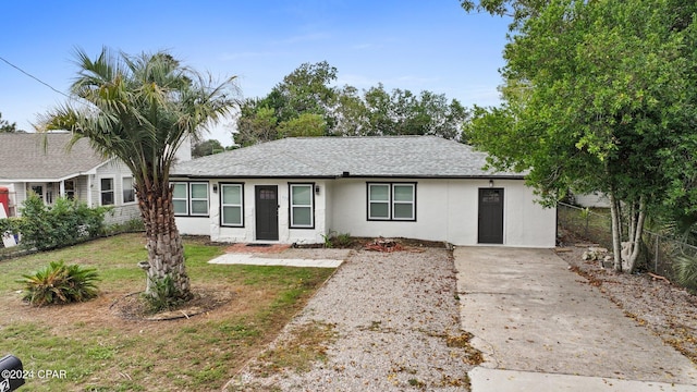 ranch-style home featuring a front yard