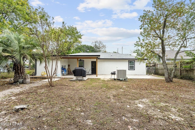 back of house featuring central AC unit and a patio