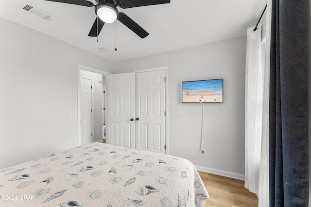 bedroom featuring ceiling fan and light hardwood / wood-style flooring