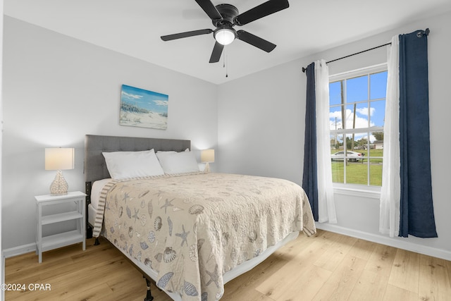 bedroom featuring ceiling fan and light hardwood / wood-style floors