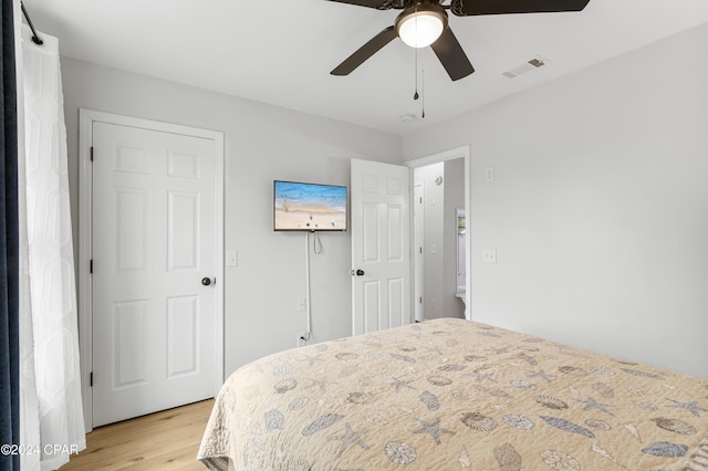 bedroom with ceiling fan and light hardwood / wood-style floors