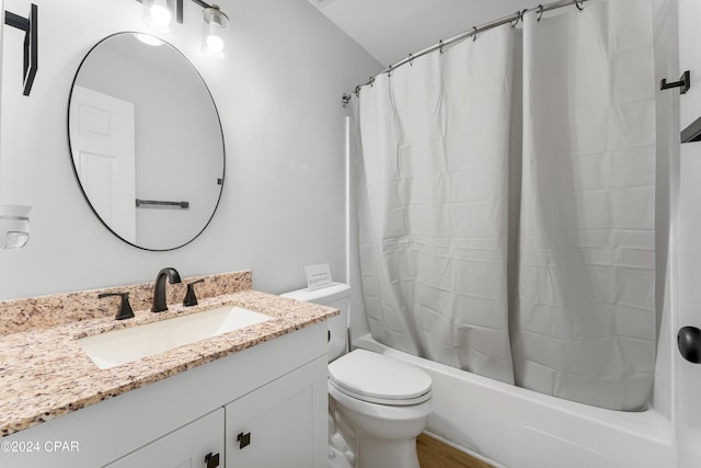 full bathroom featuring toilet, vanity, and shower / bath combo