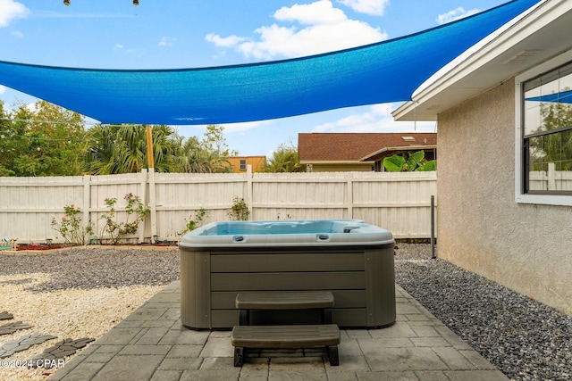 view of patio with a hot tub