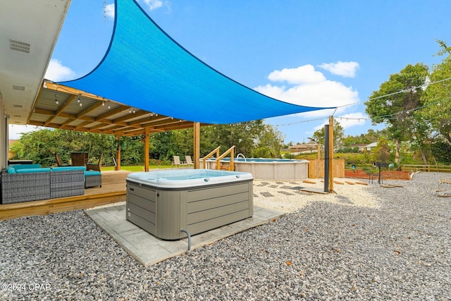 exterior space with an outdoor hangout area, a hot tub, and a deck