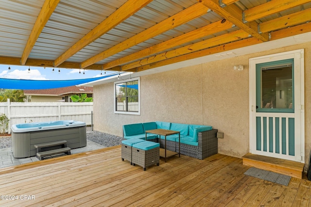 deck featuring a hot tub and outdoor lounge area