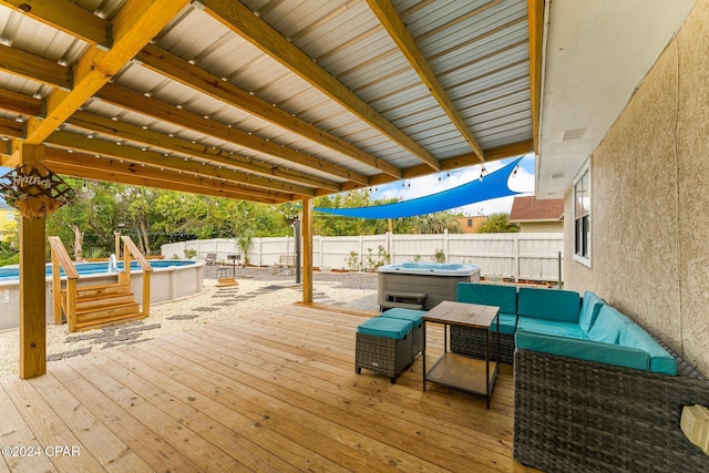 deck with a swimming pool with hot tub and an outdoor hangout area