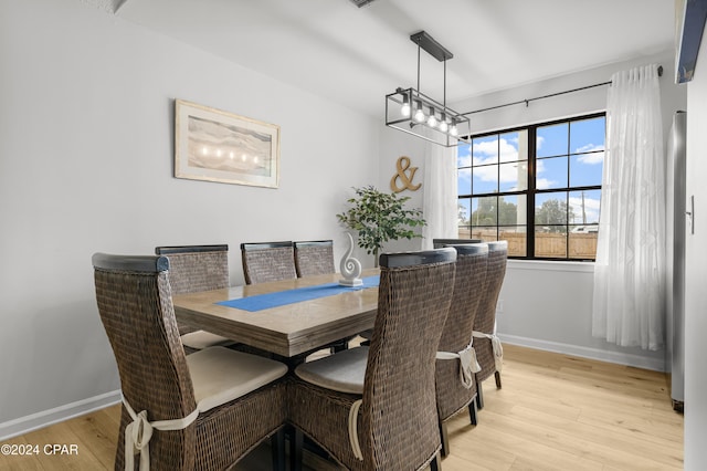 dining area with light wood-type flooring