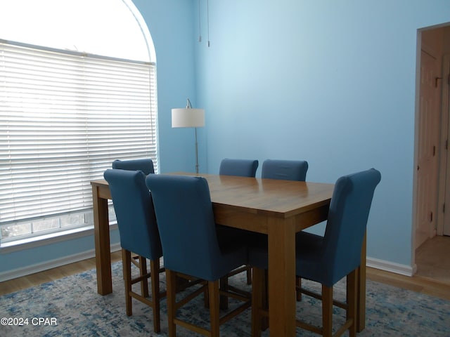 dining area with wood-type flooring