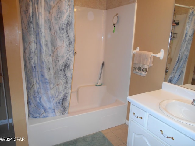 bathroom featuring tile patterned floors, vanity, and shower / bath combo