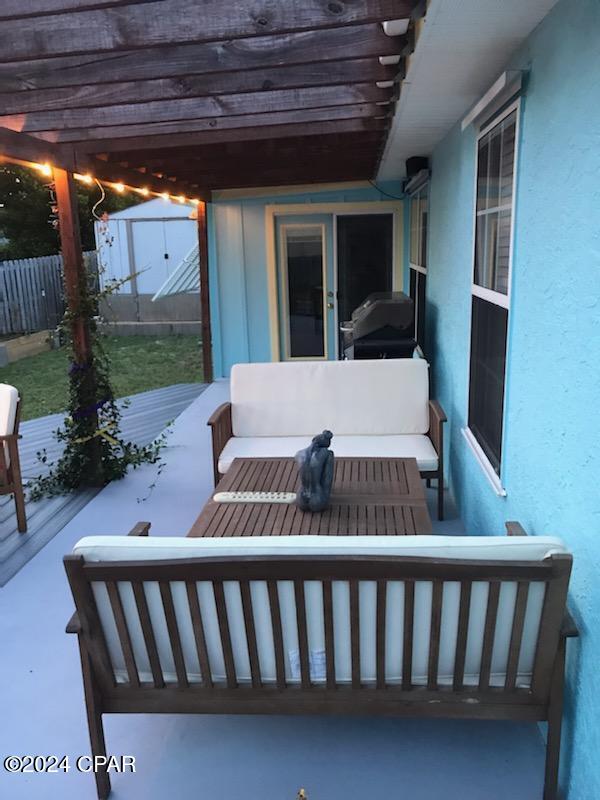 view of patio featuring area for grilling, a storage shed, a pergola, and outdoor lounge area