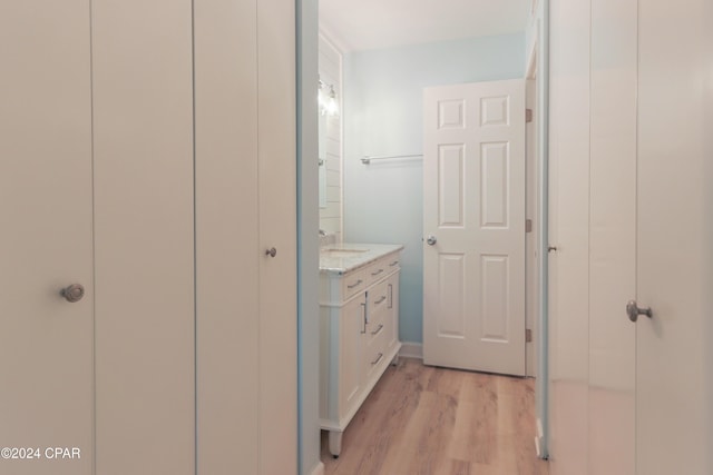 bathroom with vanity and wood finished floors