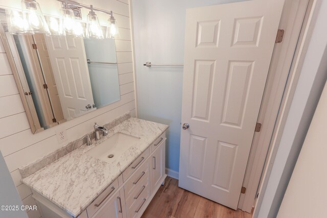 bathroom with vanity, decorative backsplash, and a notable chandelier